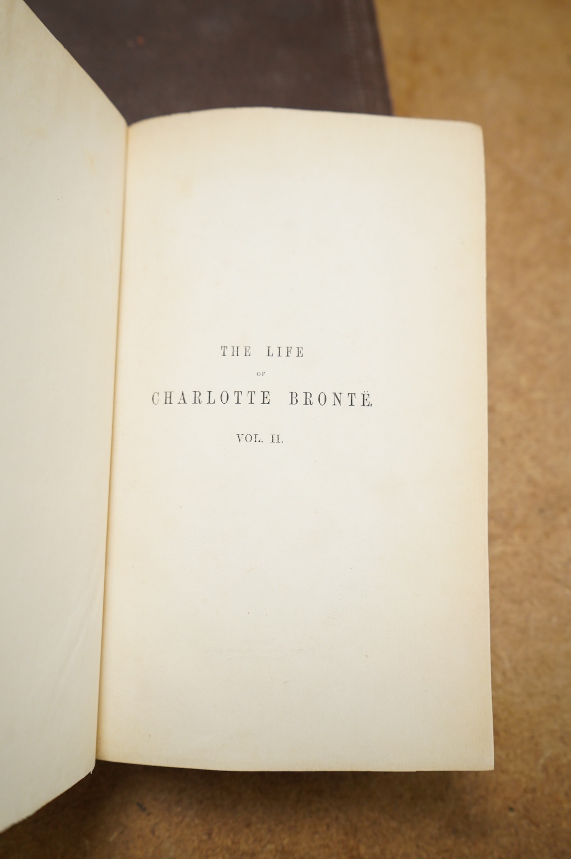 Gaskell, Elizabeth Cleghorn, The Life of Charlotte Bronte, 2 vols., second edition, 8vo, frontispieces, facsimile plate, publisher's catalogue at end of vol.II, very minor spotting, contemporary maroon cloth titled on sp